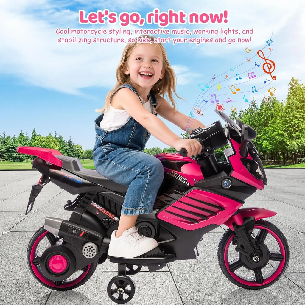 Young girl riding a pink and black electric motorcycle toy in an outdoor setting