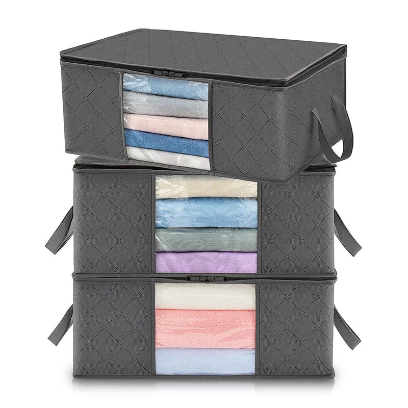 A stack of three grey rectangular foldable fabric clothing storage bags with clear plastic viewing windows.