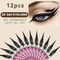 A collection of twelve black liquid eyeliner pens with an inset photo showing winged eye makeup and promotional text