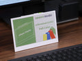 7.3 inch full color e-paper display on a desk next to a keyboard
