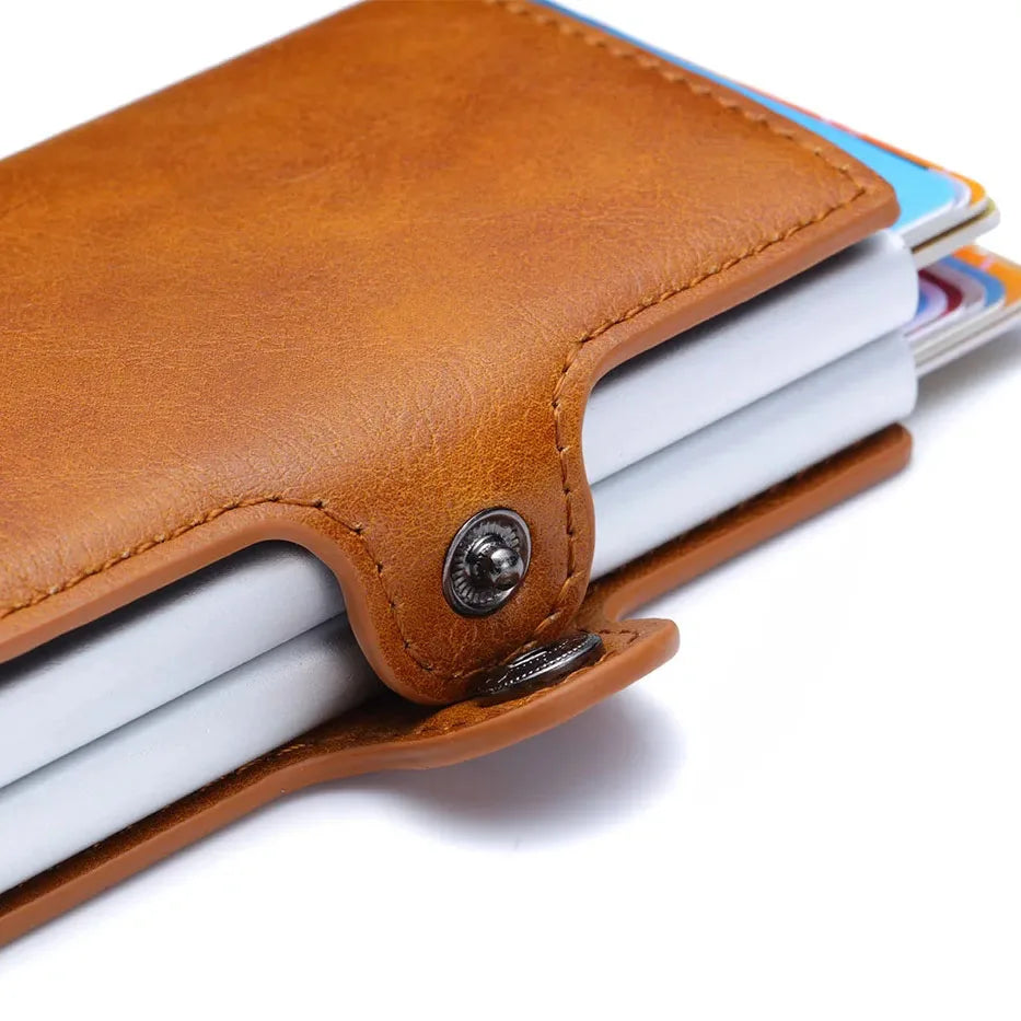 Detail view of the brown leather slim wallet with metal card storage.