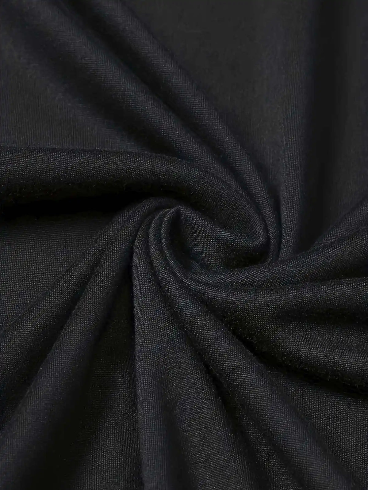 Close-up of black cotton t-shirt fabric texture