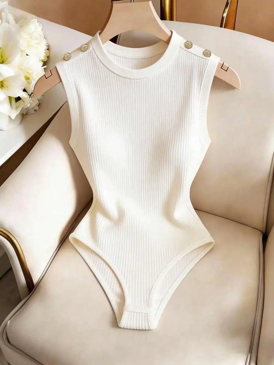 Sleeveless off-white ribbed knit bodysuit with gold decorative buttons on the shoulders