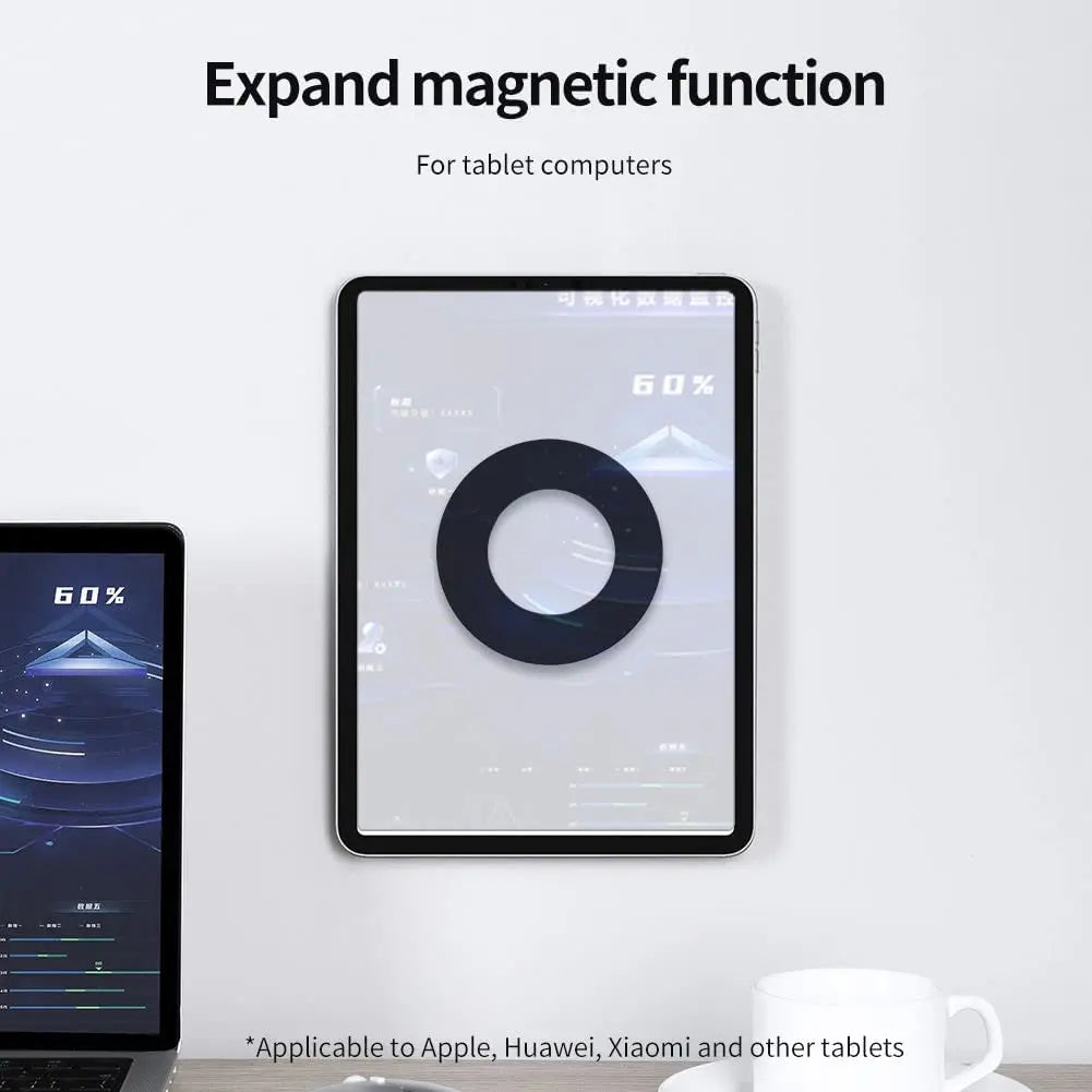 Tablet with a magnetic adhesive ring attached on the back, shown in a desktop workspace environment