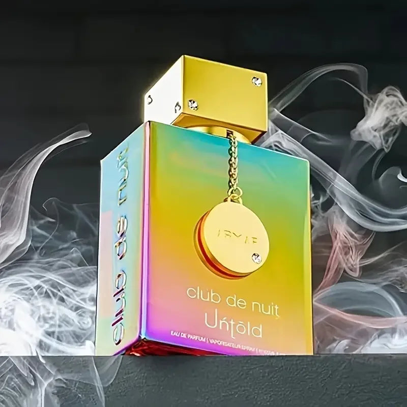 Iridescent perfume bottle with gold cap surrounded by smoke effects