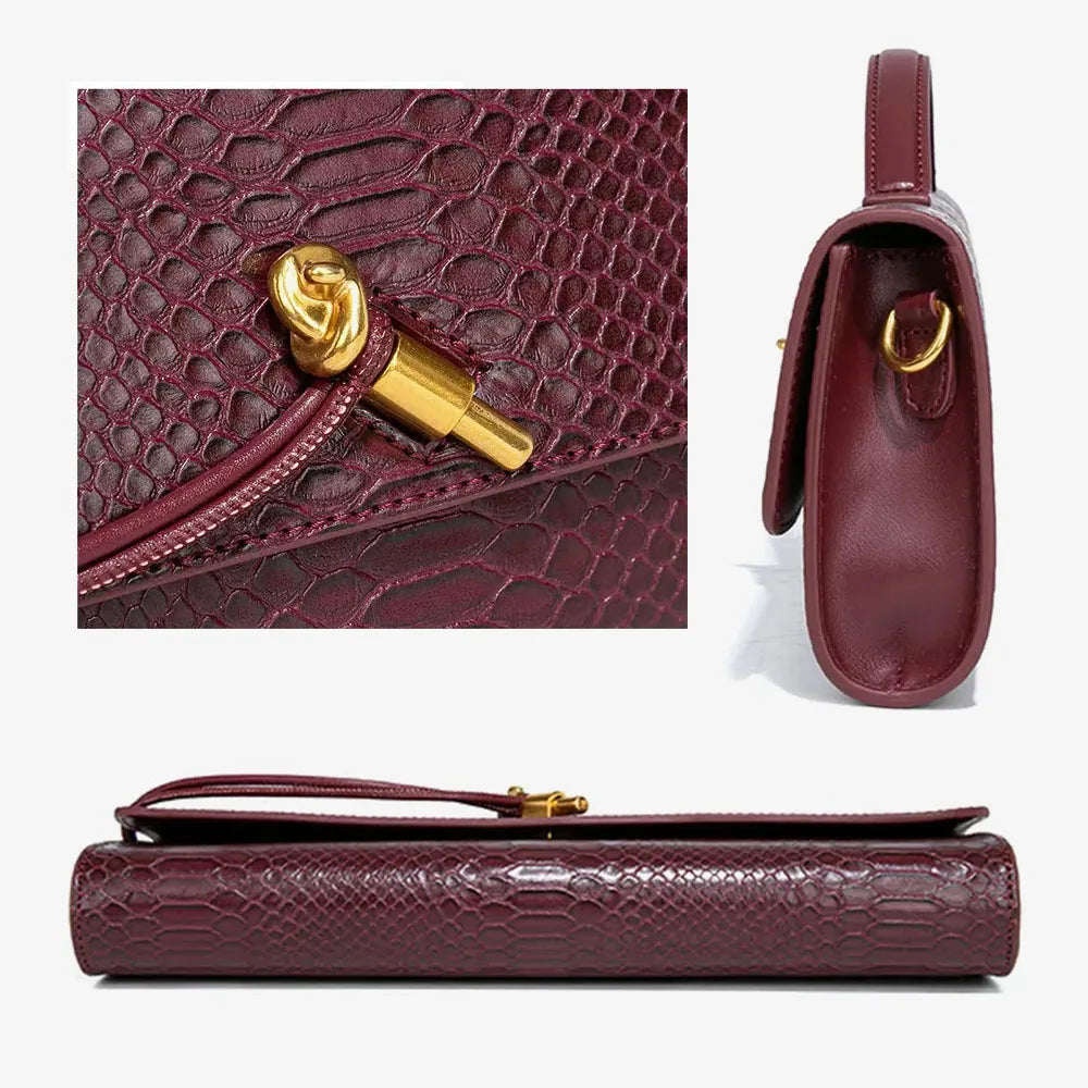 Close up views of a burgundy faux crocodile skin long clutch showing the hardware and side profile