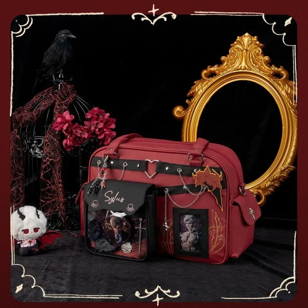 Gothic style red and black ita bag displayed with a decorative gold frame and raven decor.