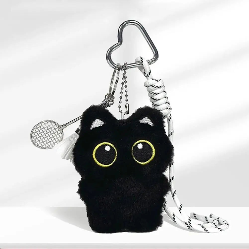 Black cat plush keychain with a white tennis racket accessory.