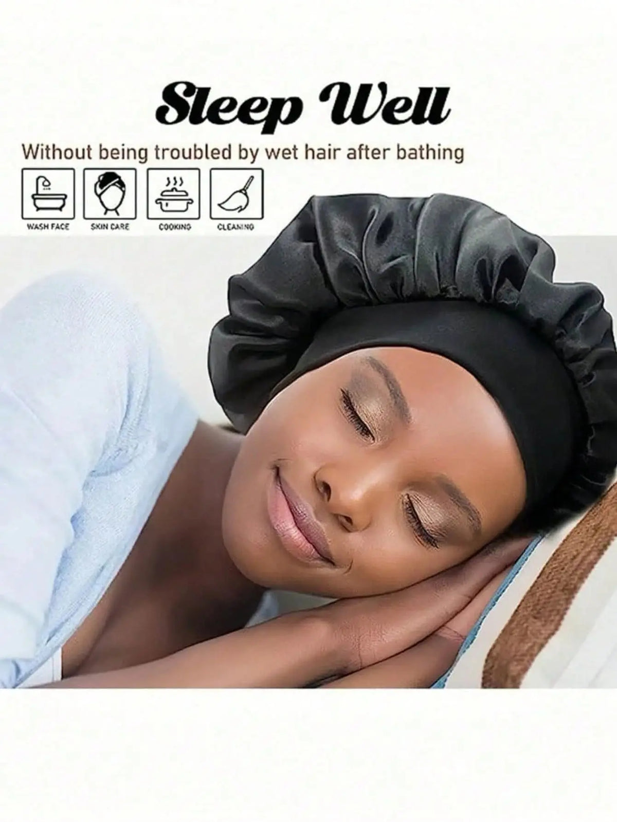 A woman sleeping comfortably while wearing a black satin hair bonnet.