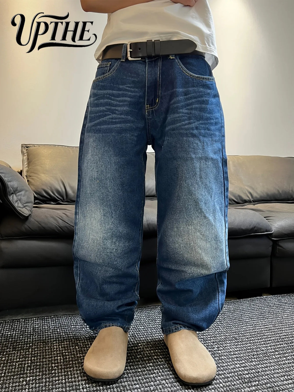 Close up of men's wide-leg denim trousers