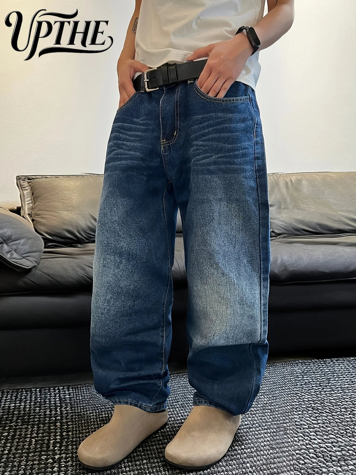Front view of men's blue wide-leg loose fit denim jeans with a zipper fly.