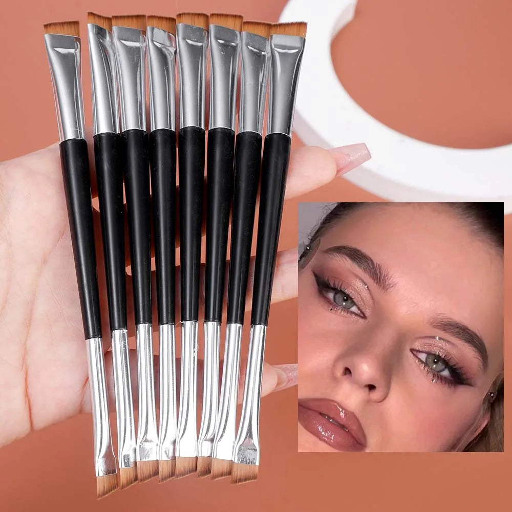 Set of 15 double-ended eyebrow brushes held in hand with model eye makeup