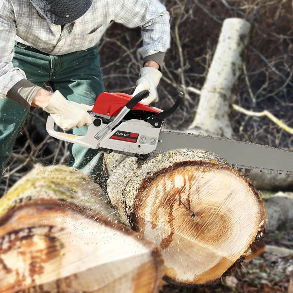 Person using a red and white chainsaw to cut a log in the forest