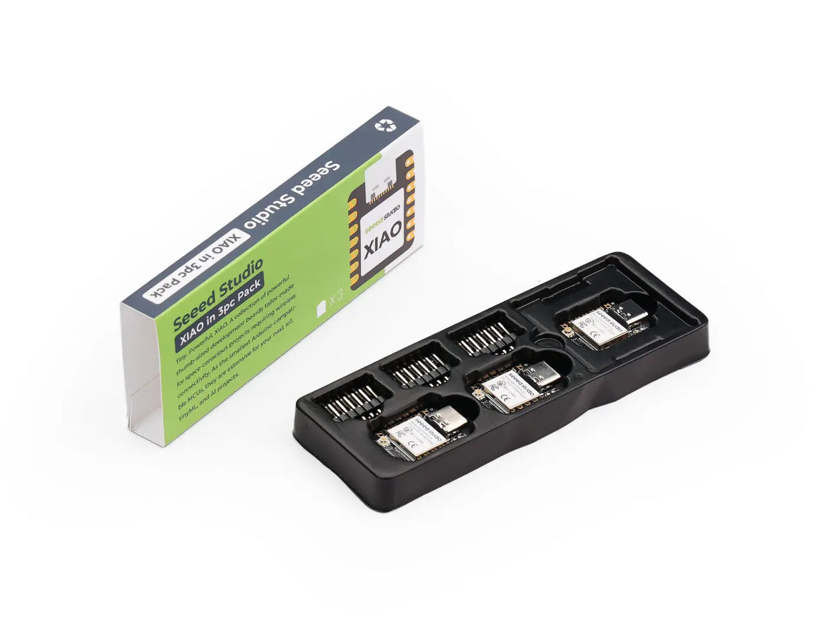 Three ESP32-S3 microcontroller development boards inside a black plastic tray with a product box.