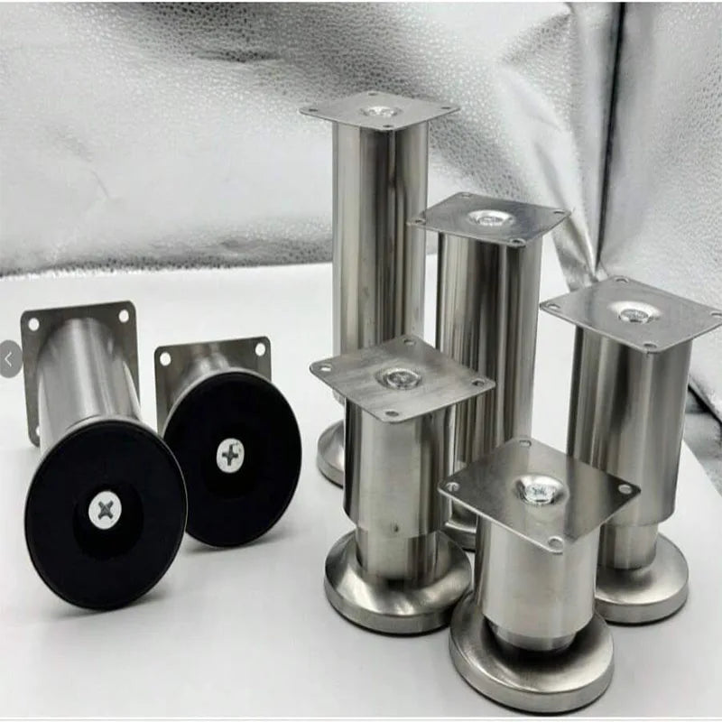 A group of adjustable stainless steel furniture legs with square mounting plates, some showing the bottom rubber pads