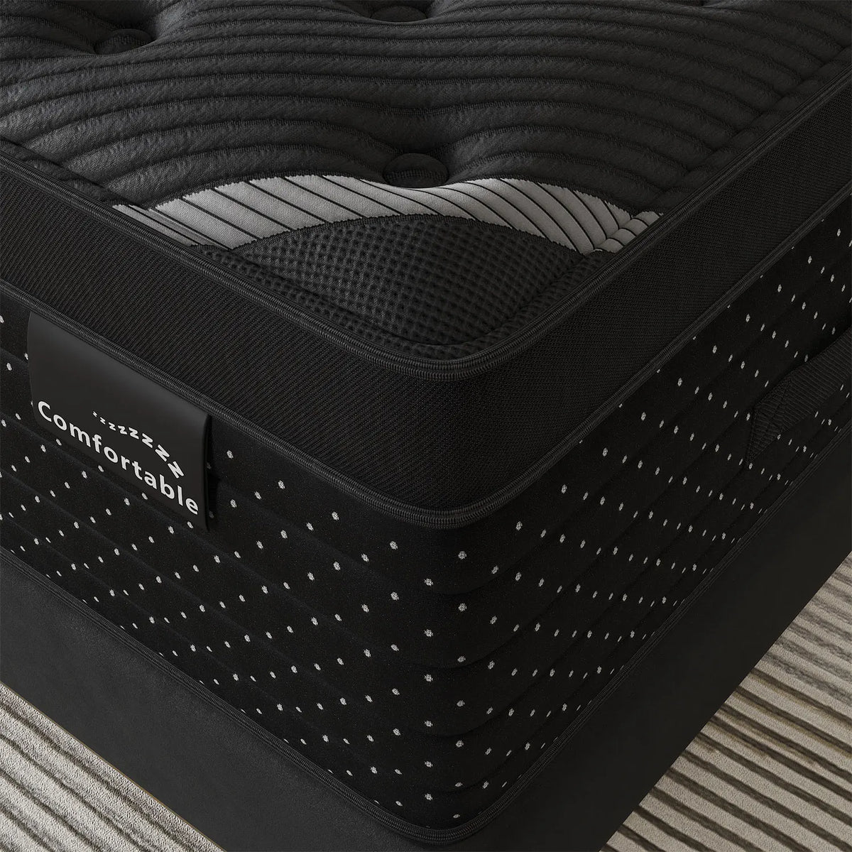 Detailed view of the quilted hybrid mattress corner and fabric texture