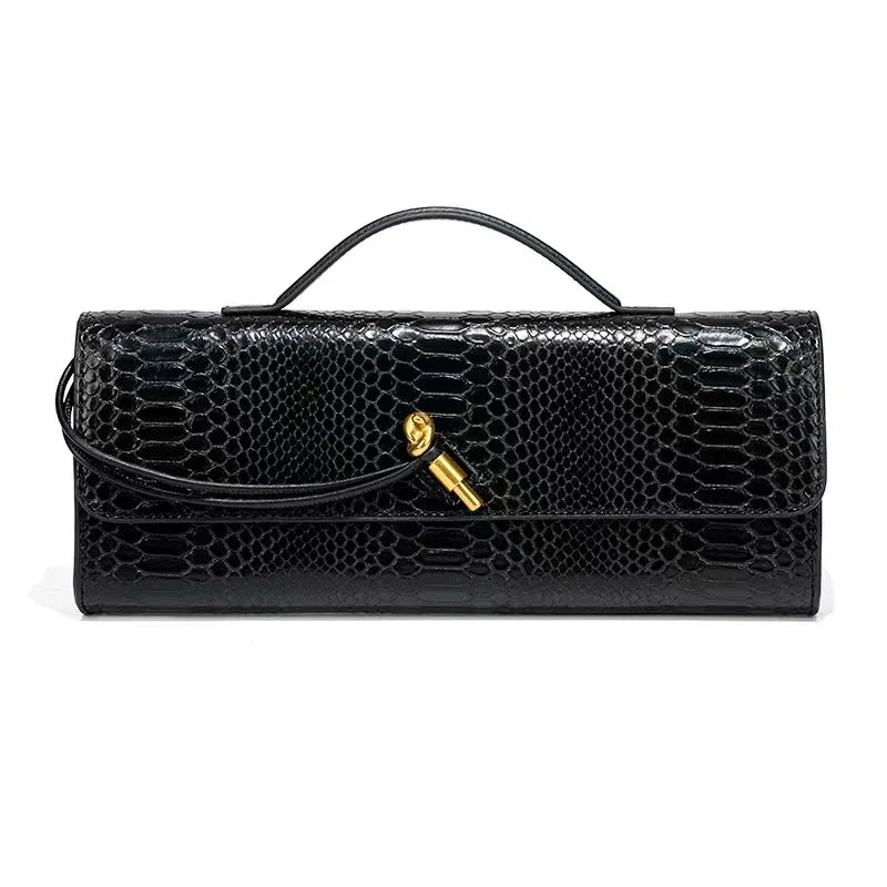 Black faux crocodile skin long clutch bag with a top handle and gold knot clasp