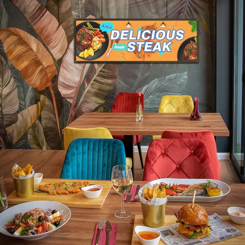 A 39x14 inch LED sign mounted above a dining table in a restaurant setting.