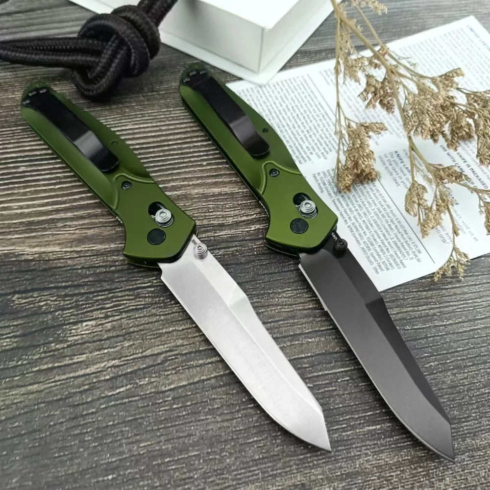 Two olive green pocket knives shown from the back side with clips.
