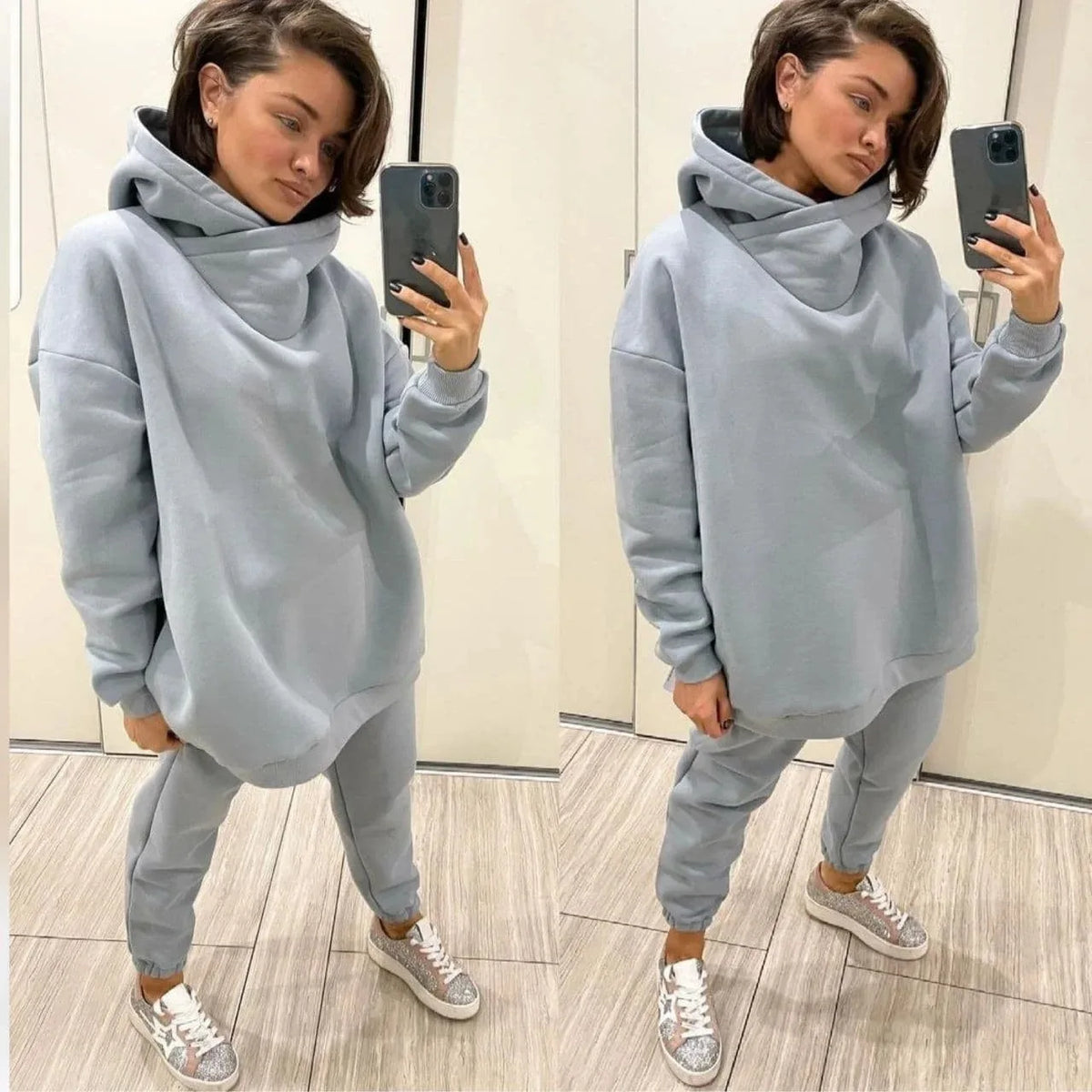 A light blue two-piece tracksuit with an oversized hooded sweatshirt and sweatpants