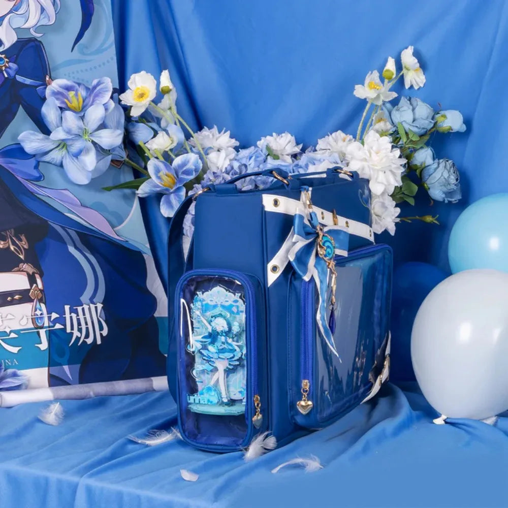 Blue tote bag displayed on blue fabric with floral decorations and character art in the background