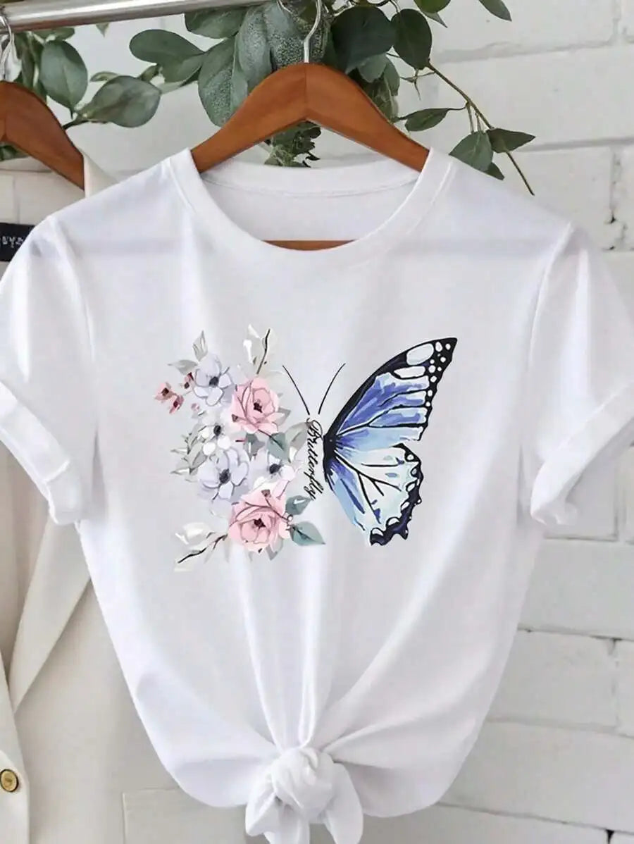 White t-shirt with floral butterfly graphic print hanging on a wooden hanger