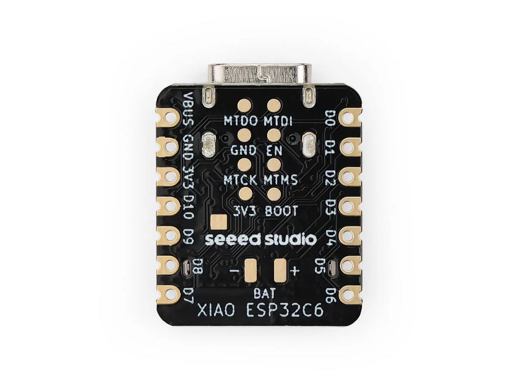 Bottom view of a development board microcontroller with printed pin labels