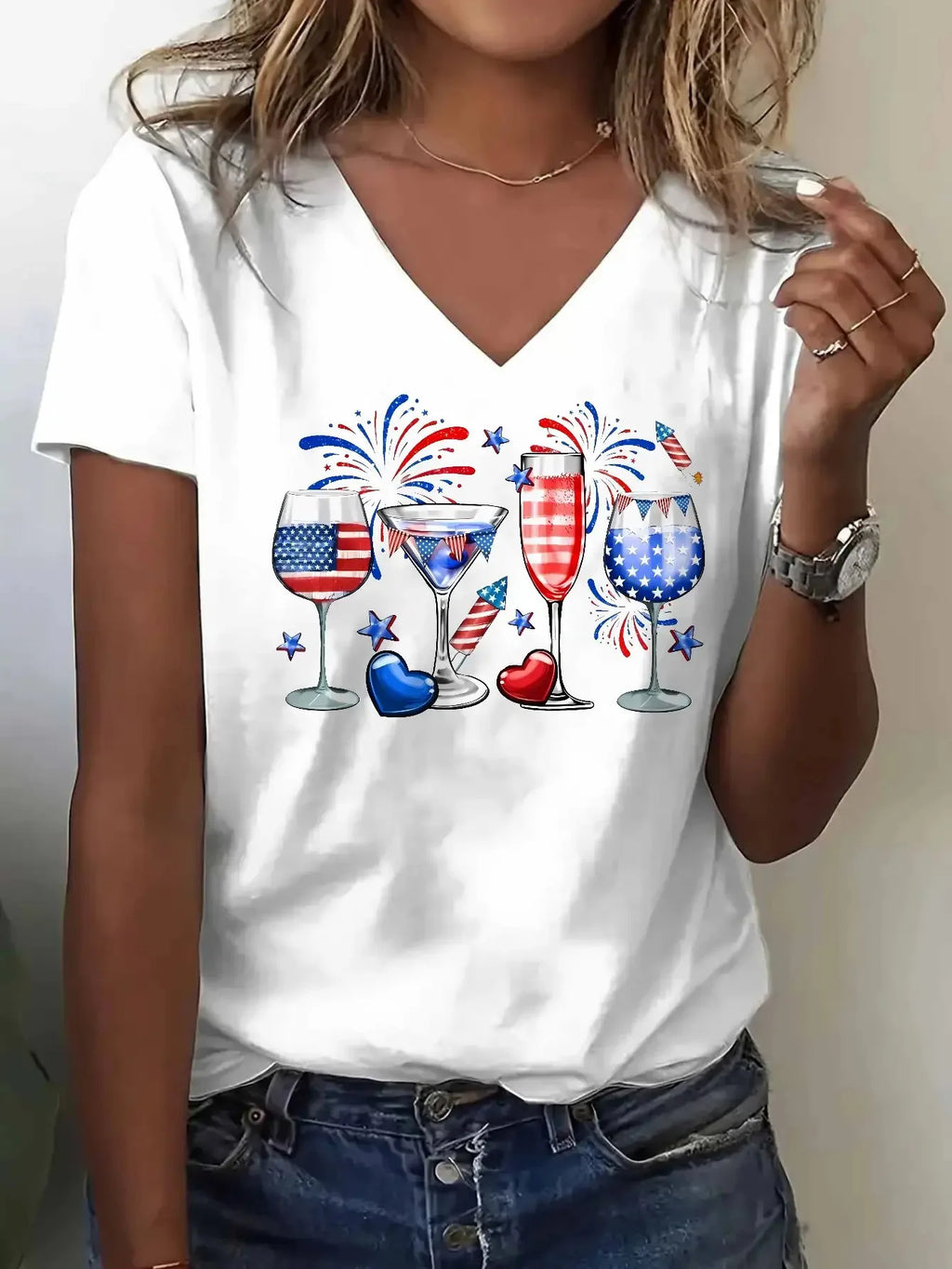 White V-neck t-shirt with American flag glasses and fireworks print worn by a woman