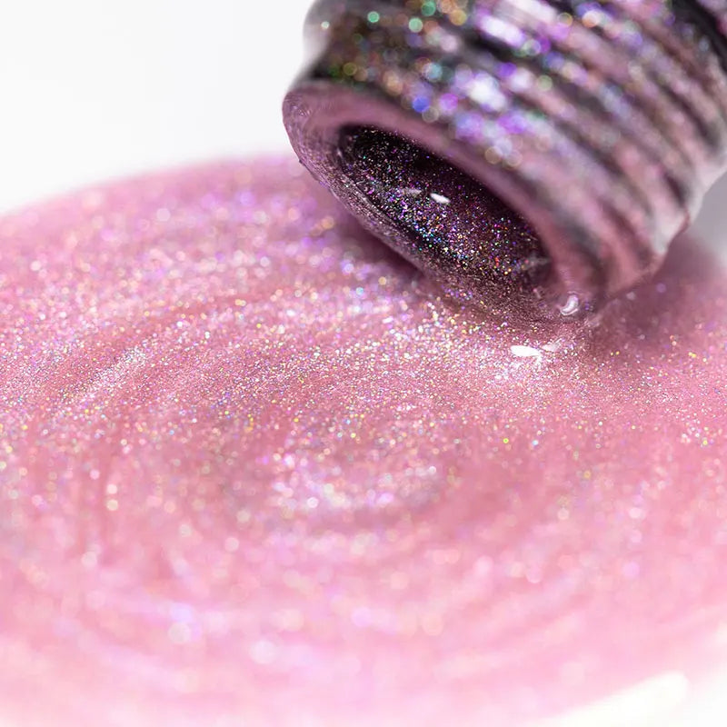 Close up of pink holographic magnetic cat eye gel nail polish texture from open bottle