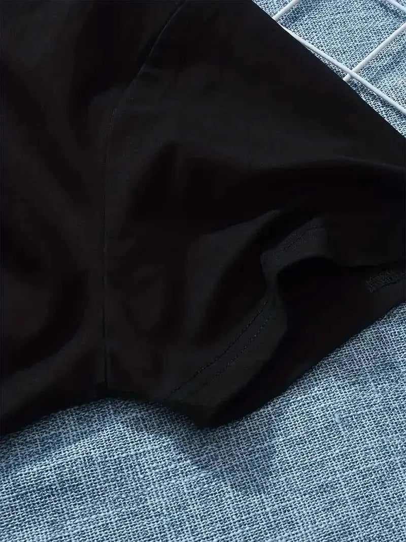 Close up detail of black fabric texture and shoulder sleeve seam