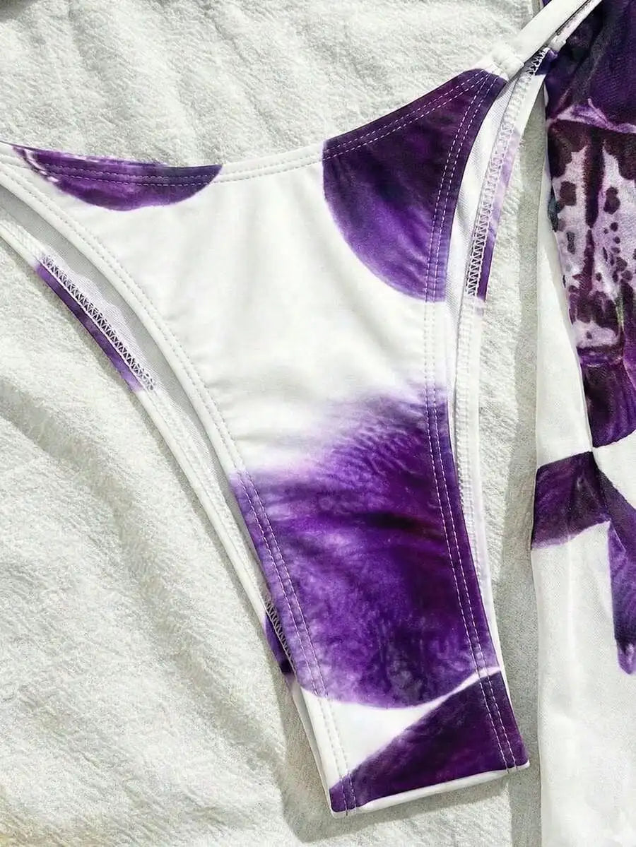 Close-up of white bikini bottoms with purple floral print