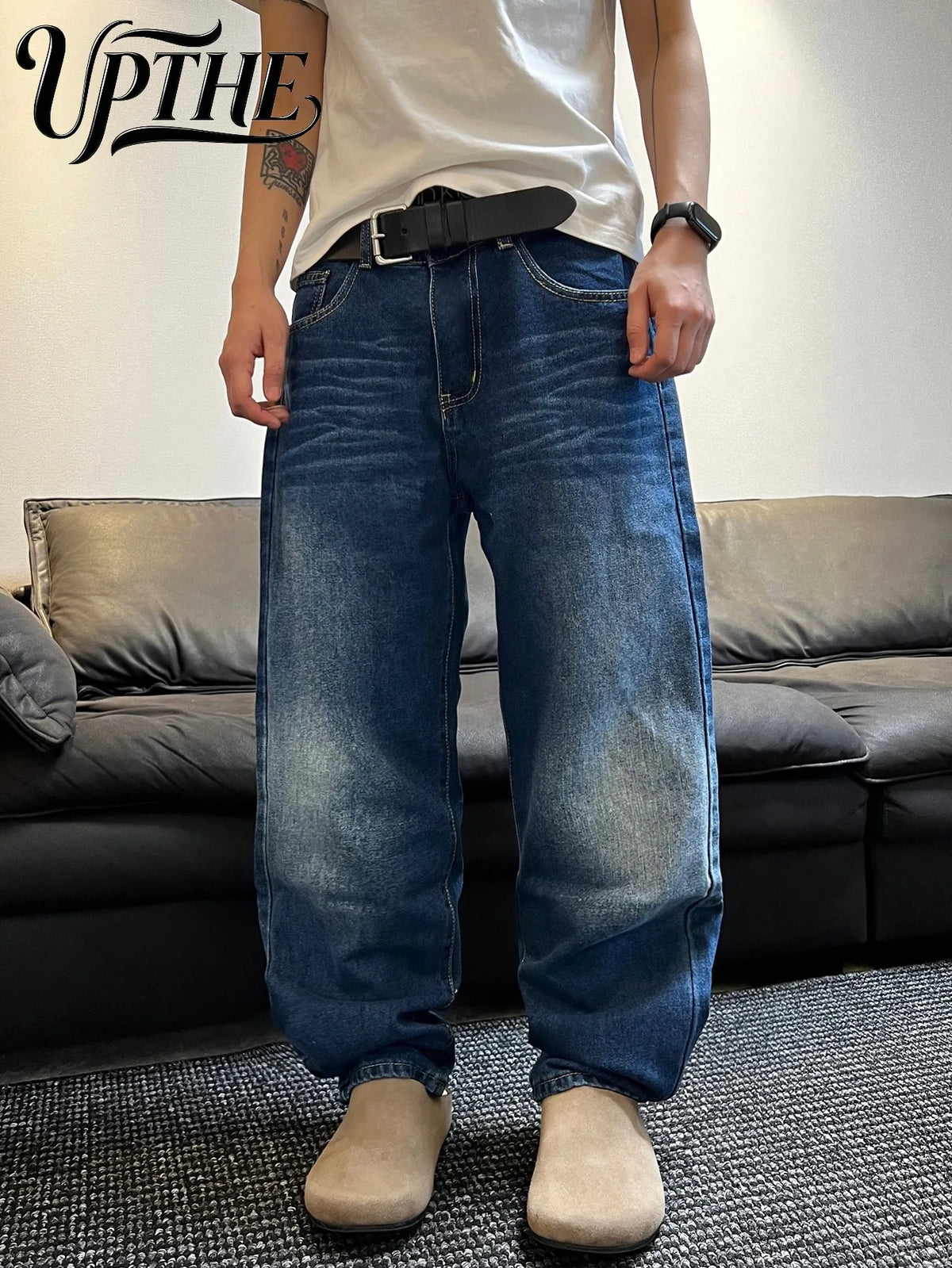 Men wearing baggy vintage style denim jeans