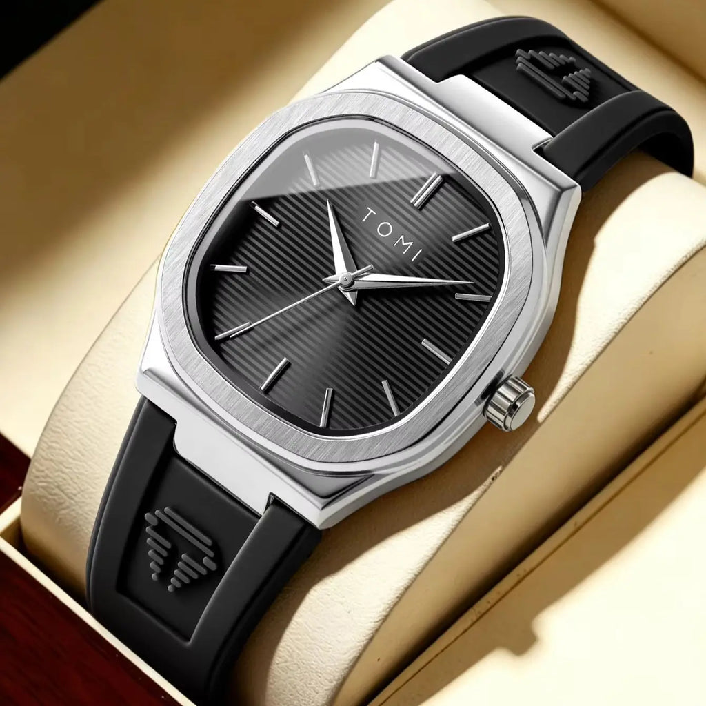 Silver square dial watch with black rubber strap in a presentation box