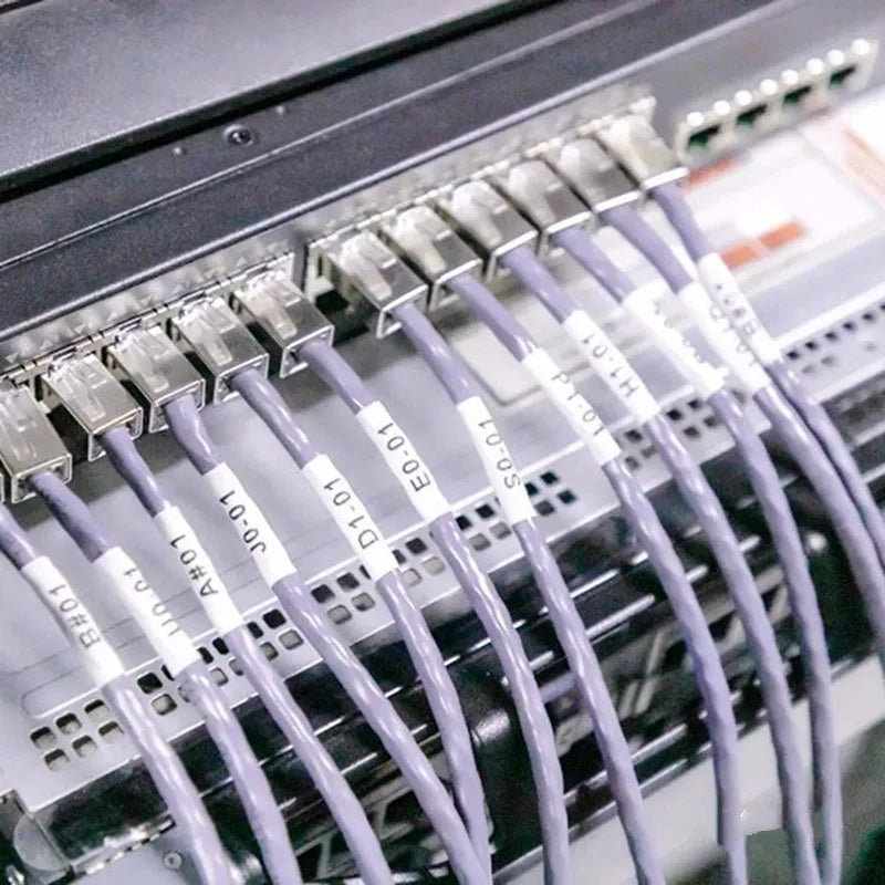 Network cables in a patch panel labeled with heat shrink tubing