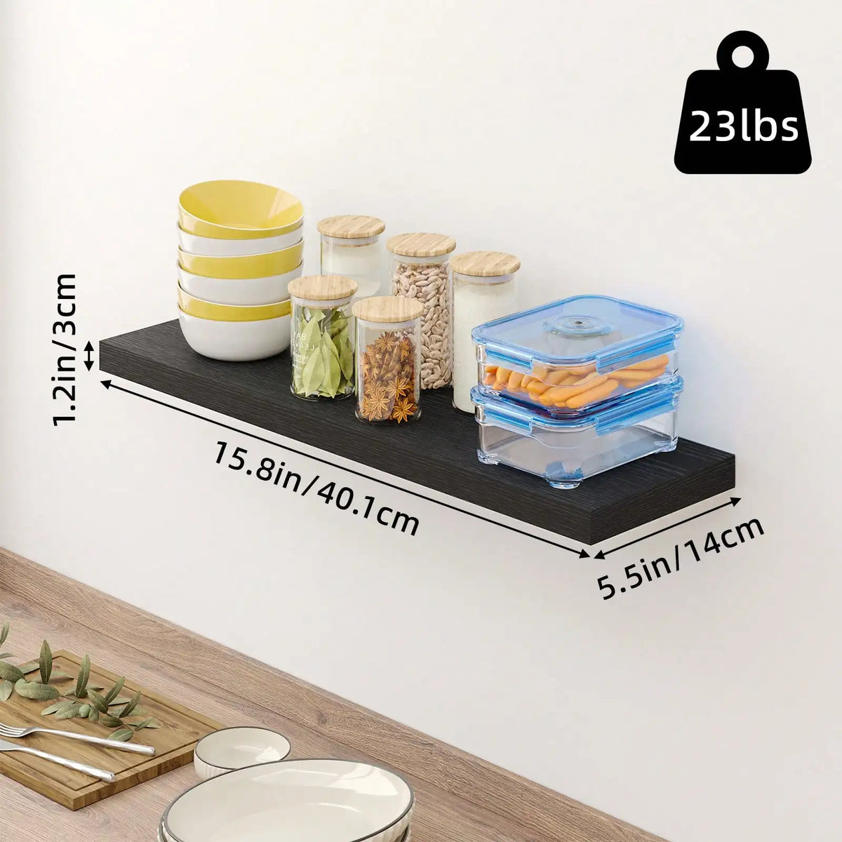 A single black floating shelf mounted on a wall, holding various kitchen containers, bowls, and jars with dimension labels