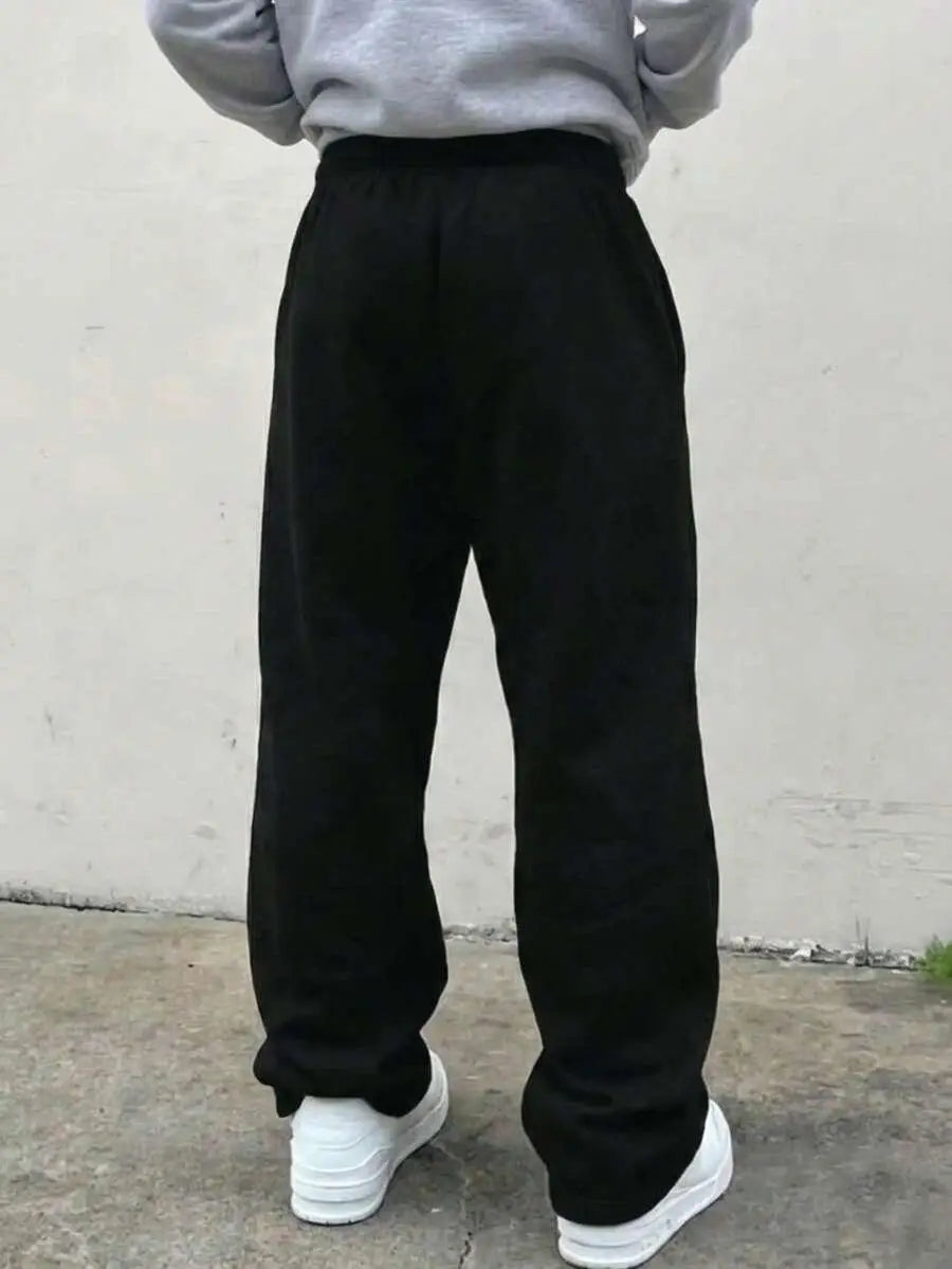 Back view of black loose sweatpants