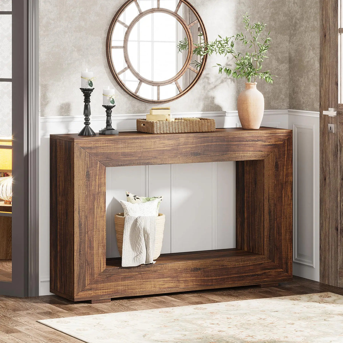 A rectangular rustic brown wooden console table with a minimalist frame design, decorated with a vase and basket.