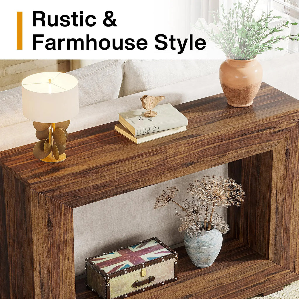 A top-down detail view of a rustic brown console table styled with a designer lamp, books, and a decorative vase.
