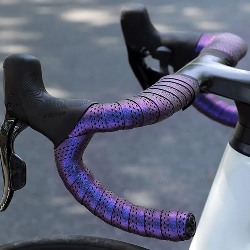 Purple iridescent bicycle handlebar tape installed on a road bike.