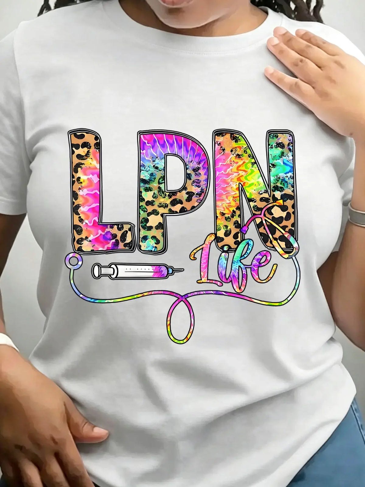 White crew neck t-shirt with leopard and tie-dye graphic text reading LPN Life featuring a syringe and stethoscope