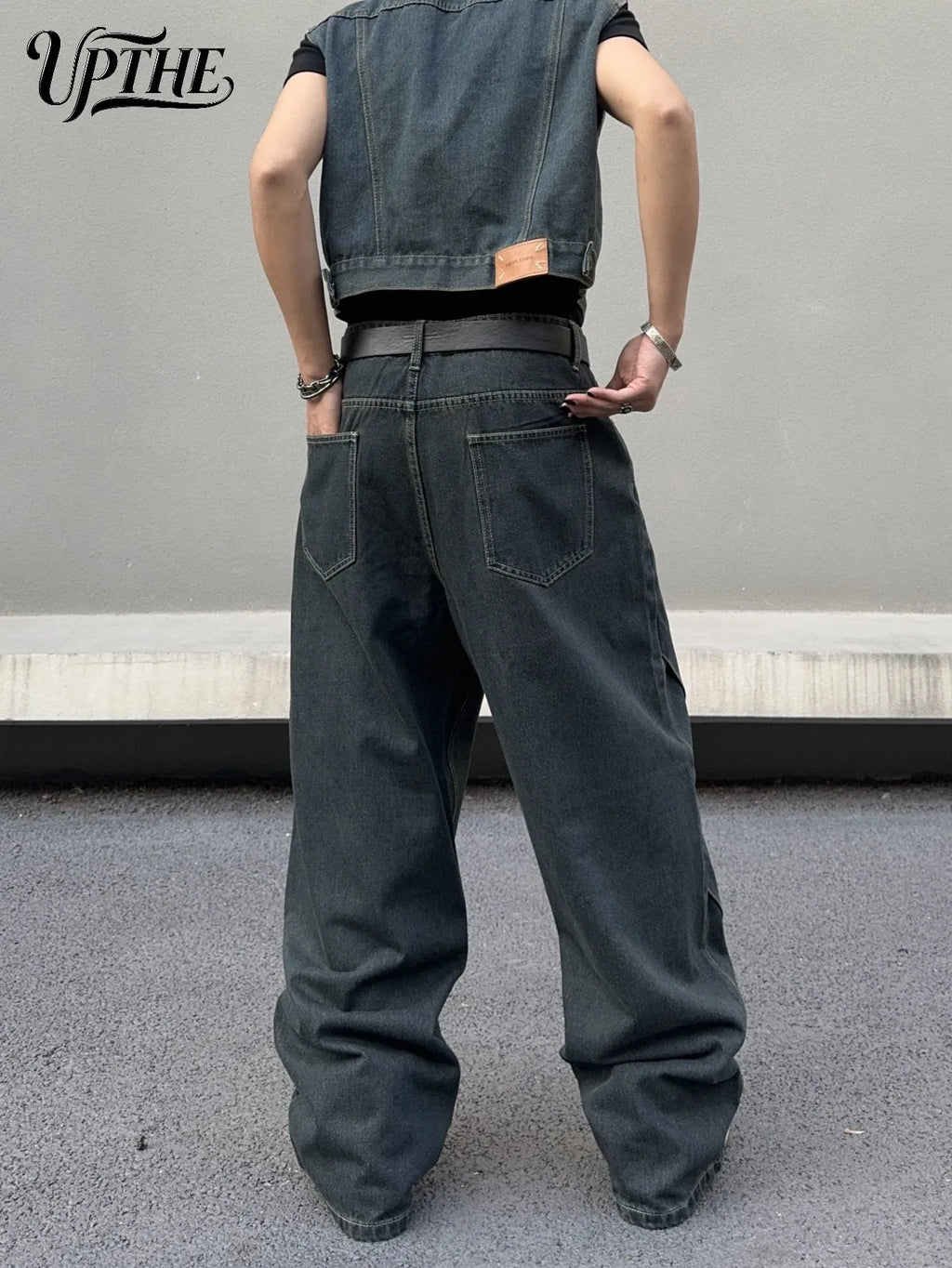 Back view of dark grey baggy wide leg denim jeans