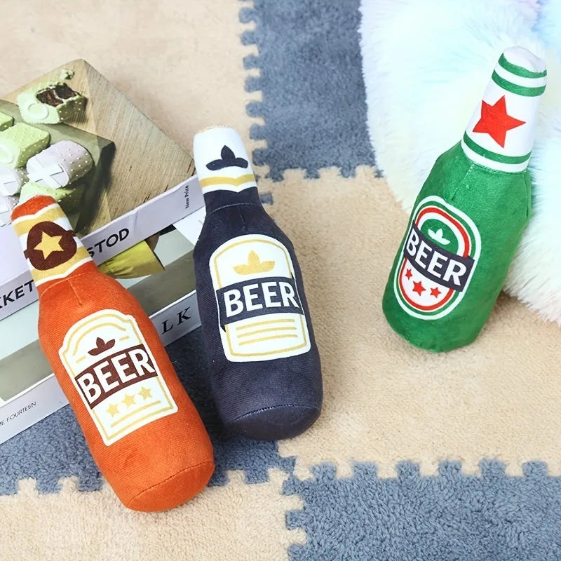 Set of three plush beer bottle dog toys in orange, black, and green colors