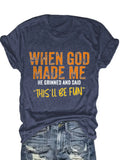 Blue short sleeve t-shirt with orange and white typography print worn tucked into denim jeans