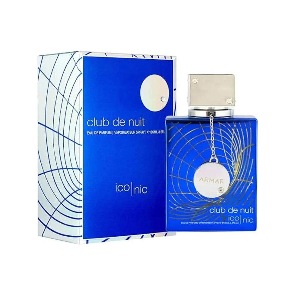 Blue square glass perfume bottle with a metallic pendant and its matching white and blue gift box.