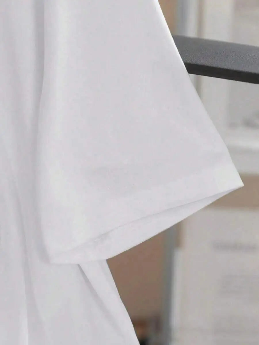 Close up of the sleeve and fabric of a plain white t-shirt