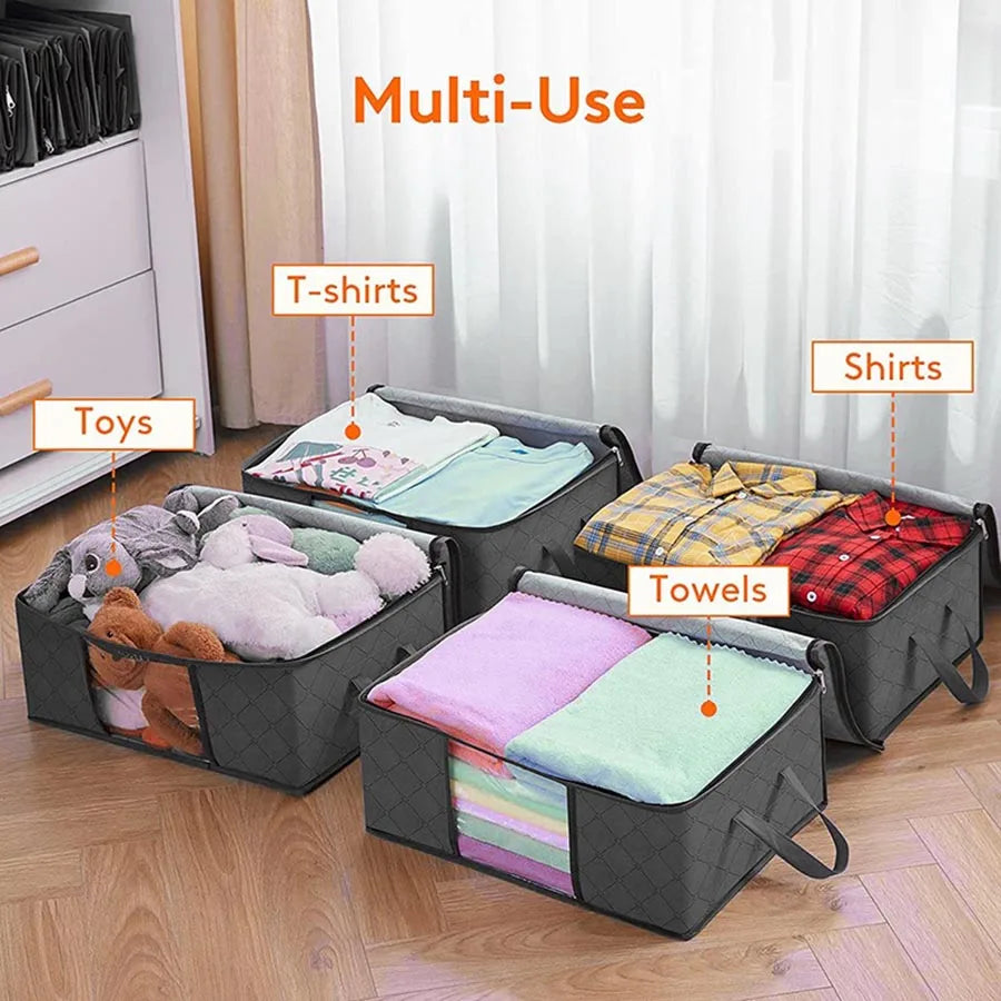 Several grey clothing storage bags in a room, labeled for toys, t-shirts, shirts, and towels.