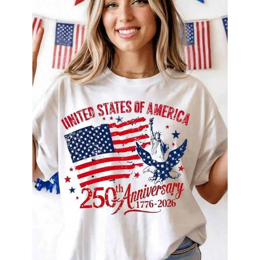 A white t-shirt featuring a vintage American flag design with an eagle and Statue of Liberty.