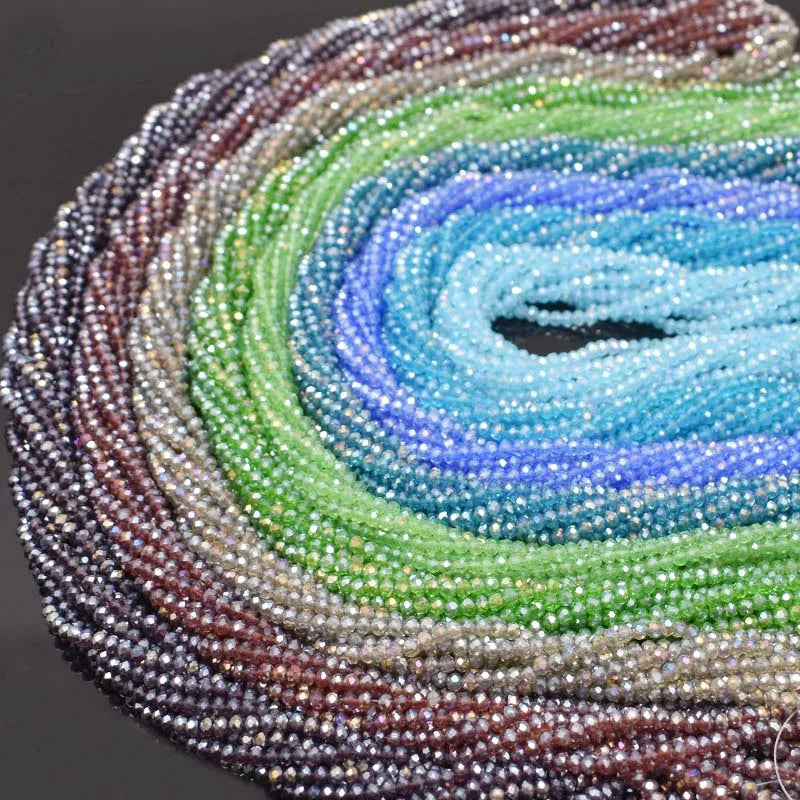 Circular arrangement of faceted rondelle crystal glass beads in cool tones