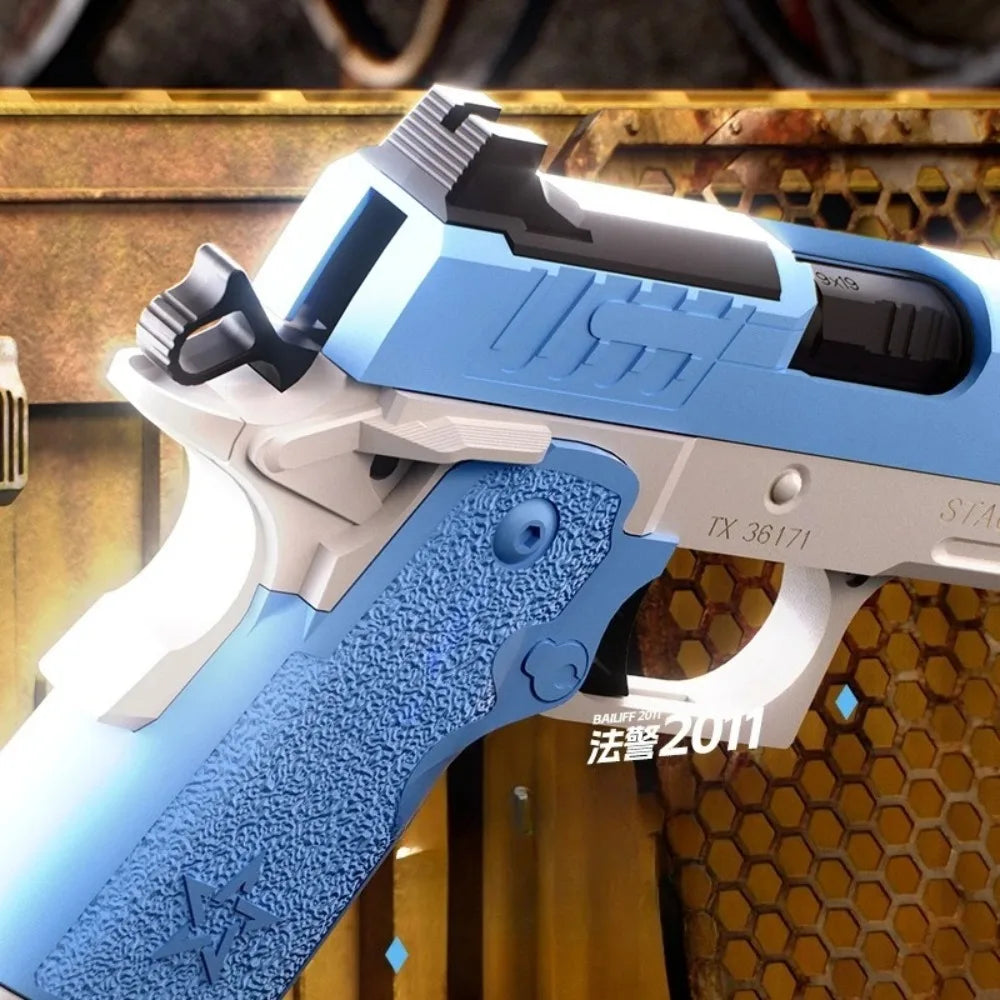 Close up of a blue and silver toy pistol on a metal background