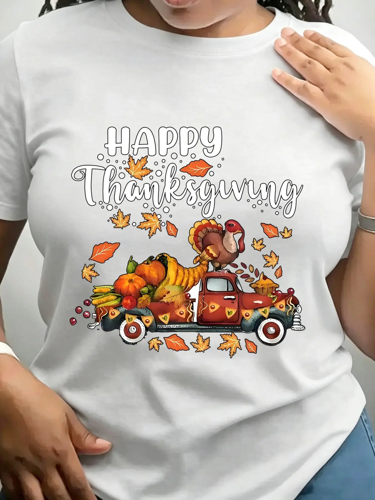 White crew neck t-shirt with a vintage truck carrying a turkey and autumn harvest illustration